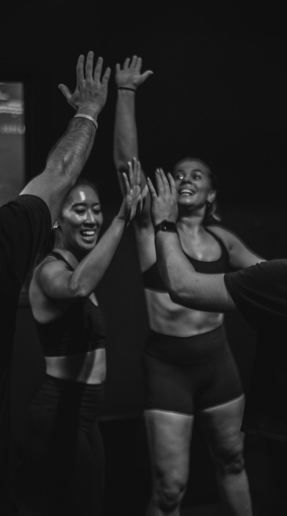 A group finishing a training session together, high-fiving