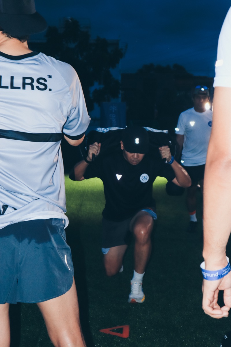 Carrying a sandbag between cones